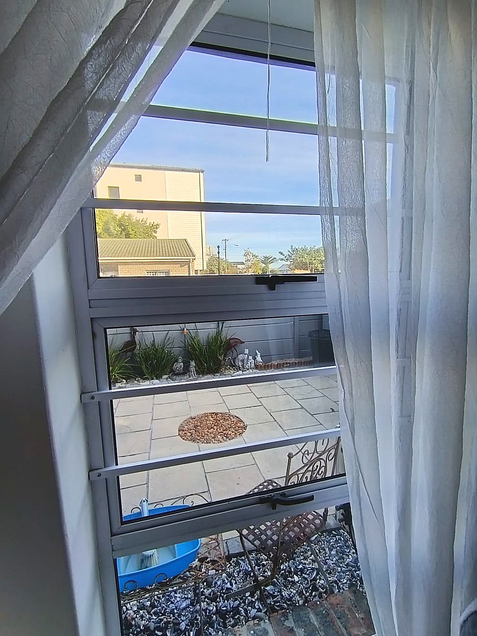 Clear horizontal burglar bars fitted to a residential window