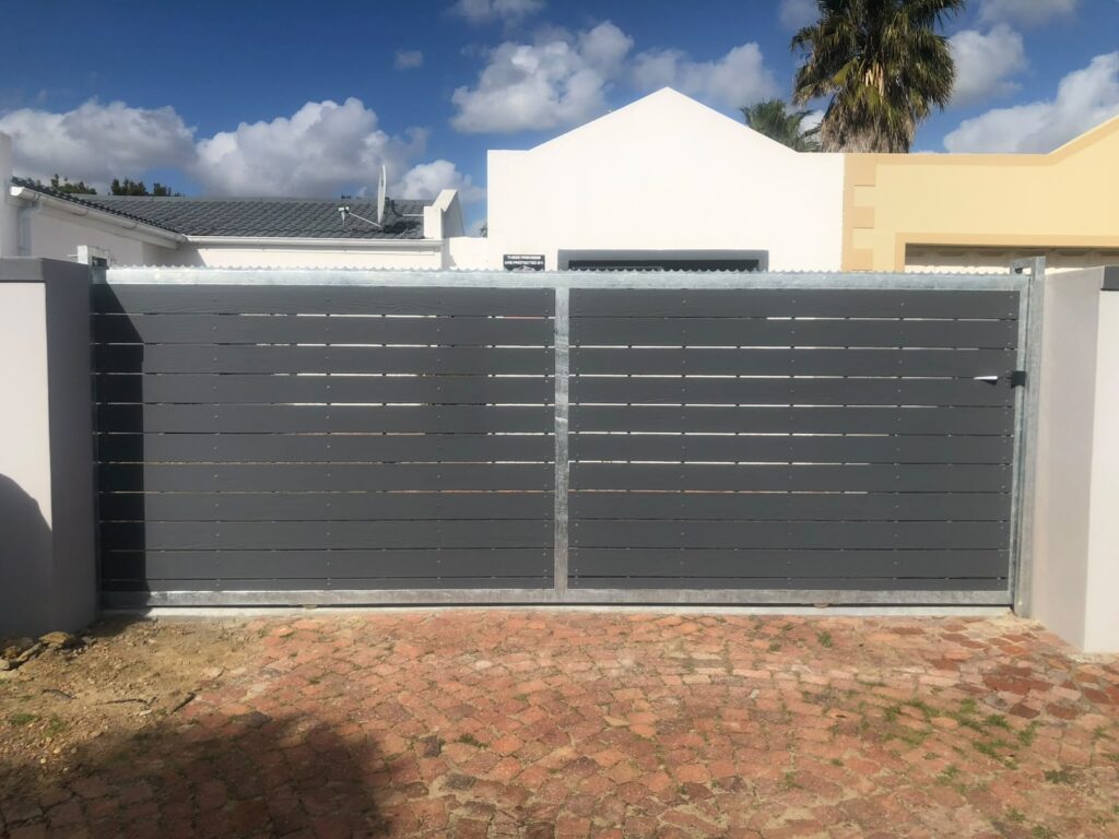 Sliding driveway gate with dark horizontal slats and galvanised steel frame in Parklands